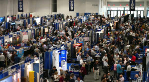 A crowd of people attending a tradeshow
